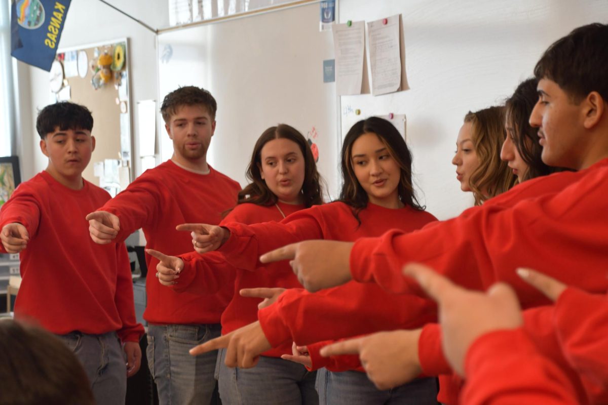 Christian Hirachata (10), Oliver Spencer (12), McKenna Leon (12), Daniela Loya-Enriquez (12), Chandler Hass Powers (11), Alysson Acosta (10) and Alejandro Rivas-Tapia (10) perform singing valentines to the student body for Valentine's Day on Feb. 12.