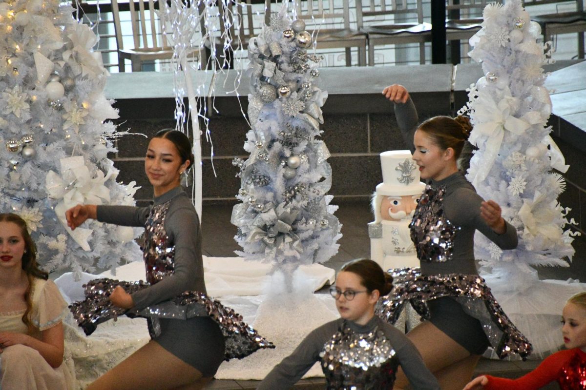 Rebecca Caballero (10) and Bridget Knopp (9) perform "Candy Canes" during the Nutcracker by E.T.A. Hoffman at the Nutcracker Tea showcase hosted in the Commons.