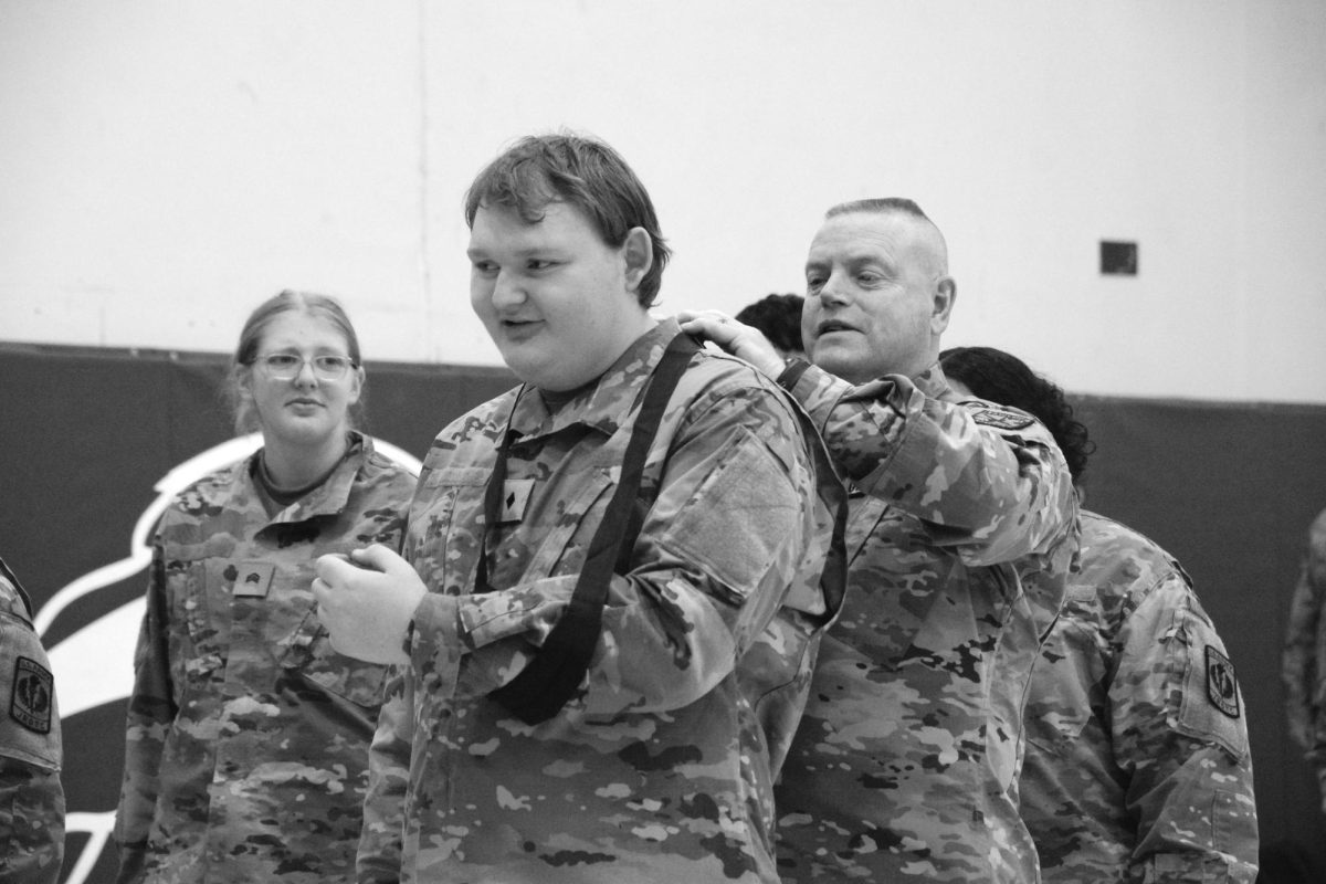 Sgt. Stephen Peterson applies a turniquet to Evan Cahill (12) as an example for the class March 2025.