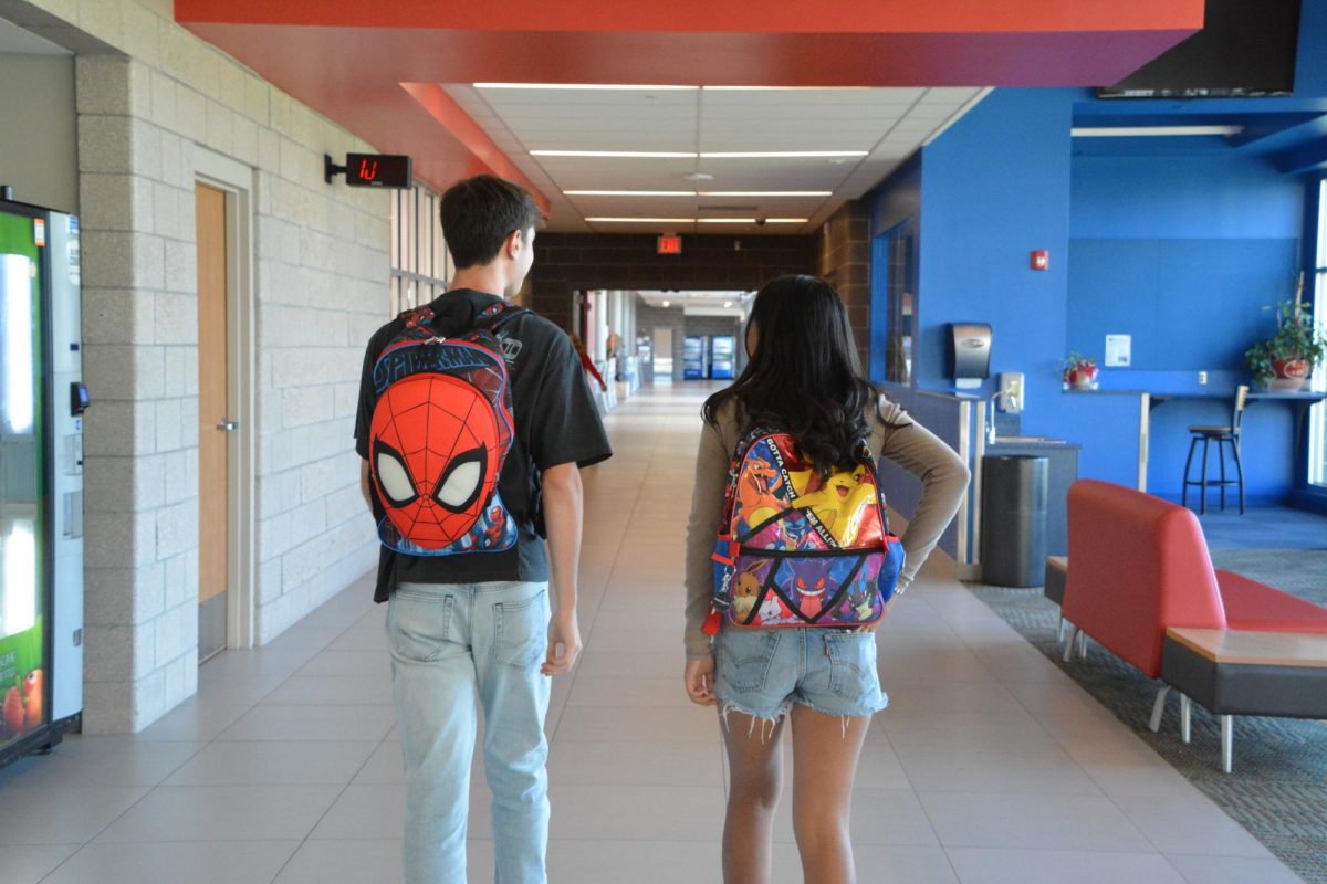 Seniors wear cartoon themed backpacks for last year of high school.