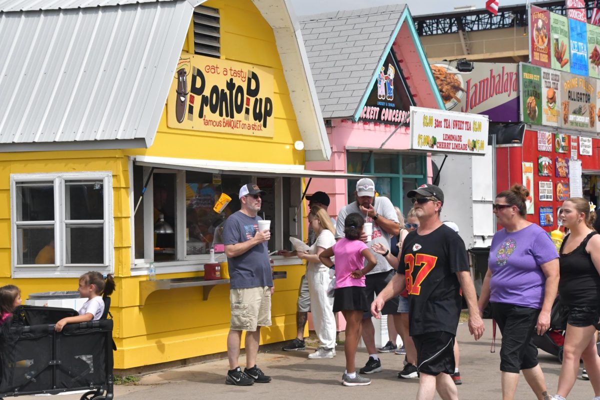 Kansas State Fair goers line up to enjoy a Pronto Pup on Sept. 13, 2025. The State Fair is held in Hutchinson Kansas every year, this year the fair was Sept. 5-14.